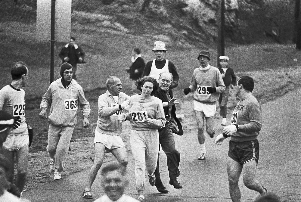 The race director of the Boston Marathon attacks Kathrine Switzer on the course.