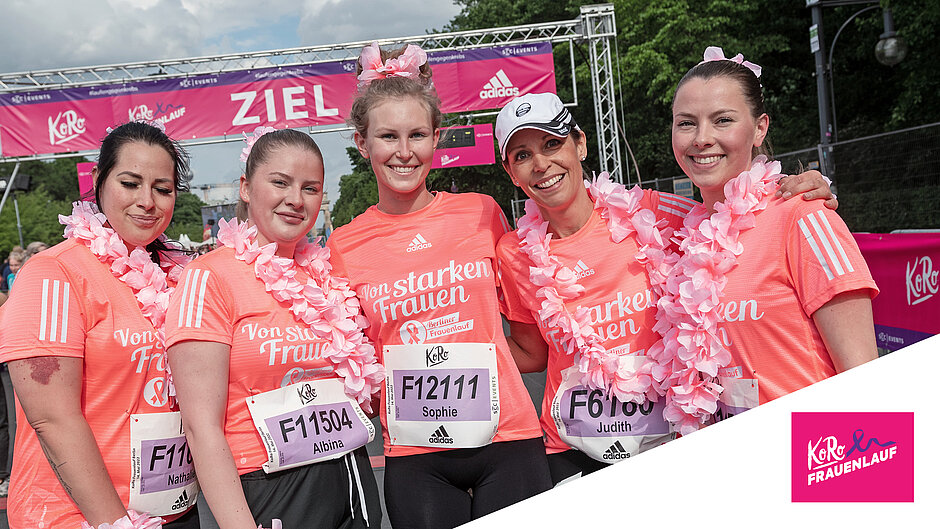 Happy finishers shortly after crossing the finish line at the Koro Berlin Women's Run. Five happy finishers of the Koro Berlin Women's Run enjoy their photoshoot behind the finish line. ©Tilo Wiedensohler / SCC EVENTS